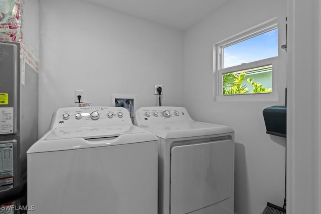 washroom with laundry area and separate washer and dryer