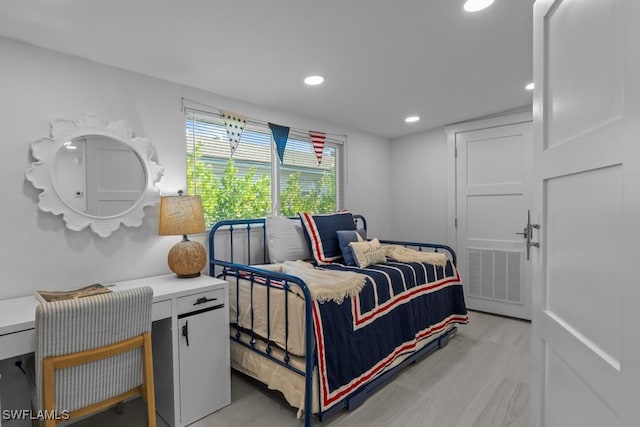 bedroom featuring light wood-style flooring, visible vents, and recessed lighting