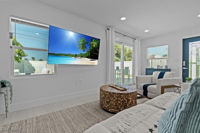 bedroom featuring access to outside, baseboards, and recessed lighting