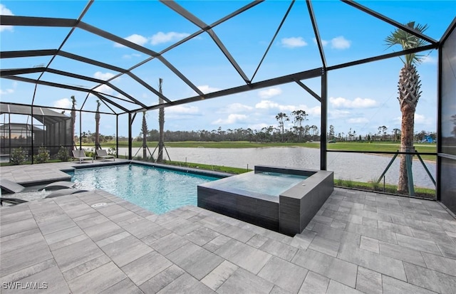 pool featuring a patio, a water view, a lanai, and an in ground hot tub