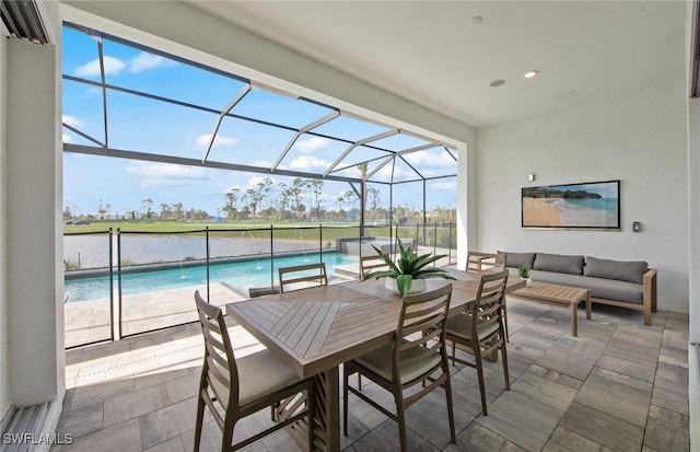 view of patio / terrace featuring outdoor dining area, outdoor lounge area, glass enclosure, a jacuzzi, and an outdoor pool