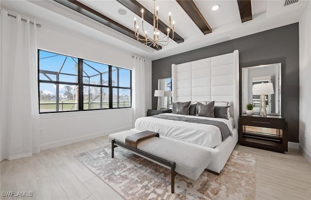 bedroom featuring a notable chandelier, light wood-type flooring, beam ceiling, and baseboards