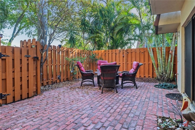 view of patio featuring fence