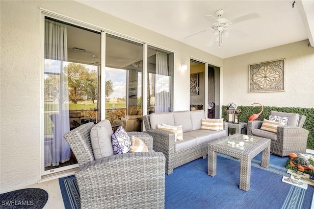 sunroom featuring ceiling fan