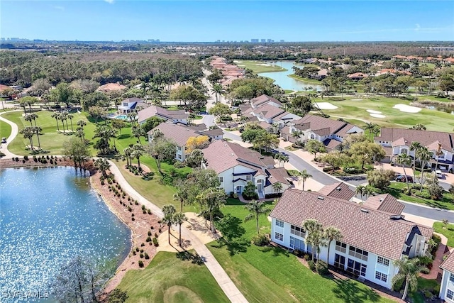 birds eye view of property featuring a water view, a residential view, and golf course view