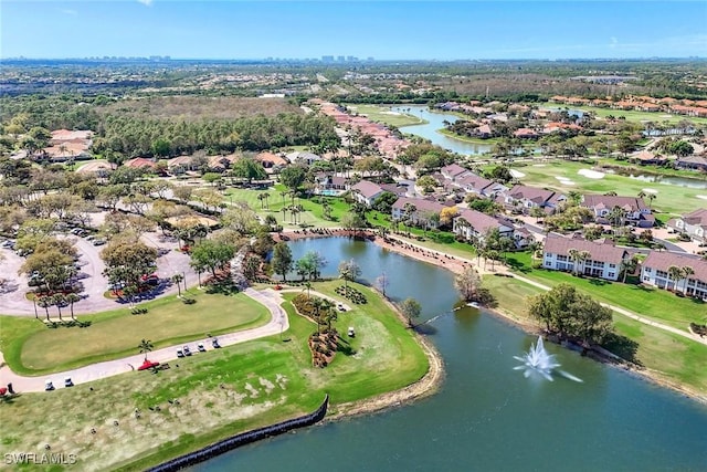 bird's eye view with a water view, view of golf course, and a residential view