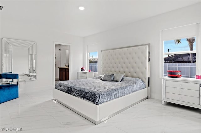 bedroom with marble finish floor, ensuite bath, baseboards, and recessed lighting