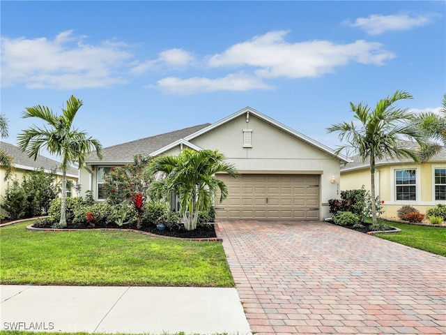 ranch-style house with a garage, a front lawn, decorative driveway, and stucco siding