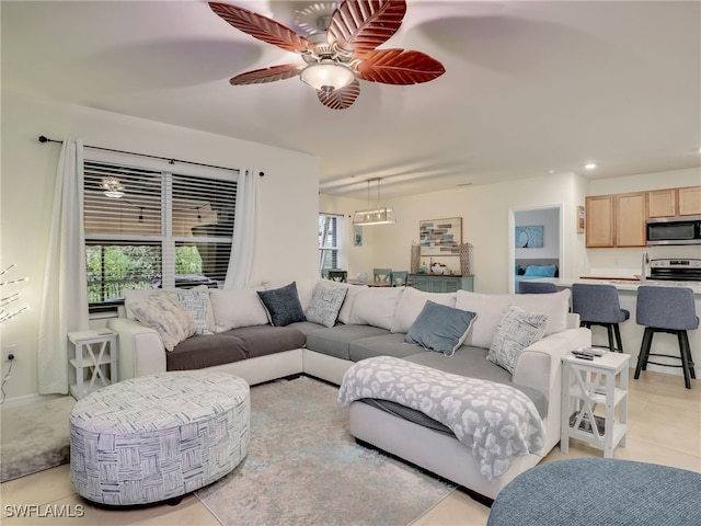 living area featuring ceiling fan, light tile patterned flooring, and recessed lighting