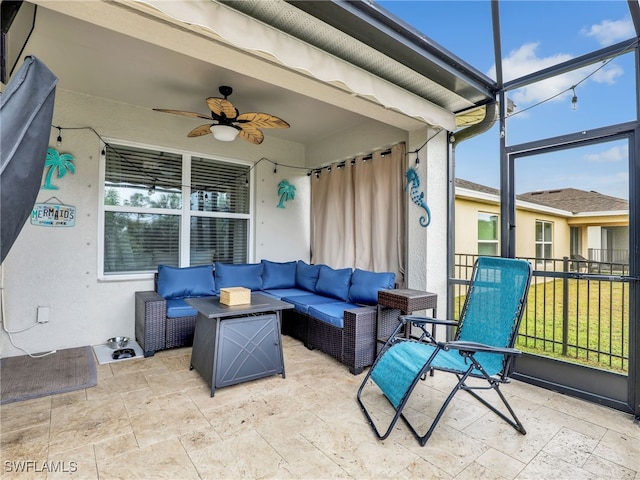 sunroom / solarium with a healthy amount of sunlight and ceiling fan