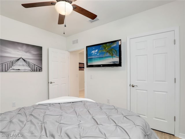 bedroom featuring ceiling fan and visible vents