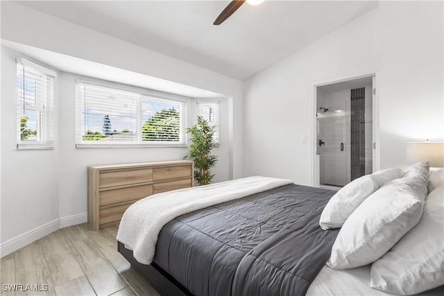 bedroom featuring a ceiling fan, lofted ceiling, light wood-style flooring, and baseboards