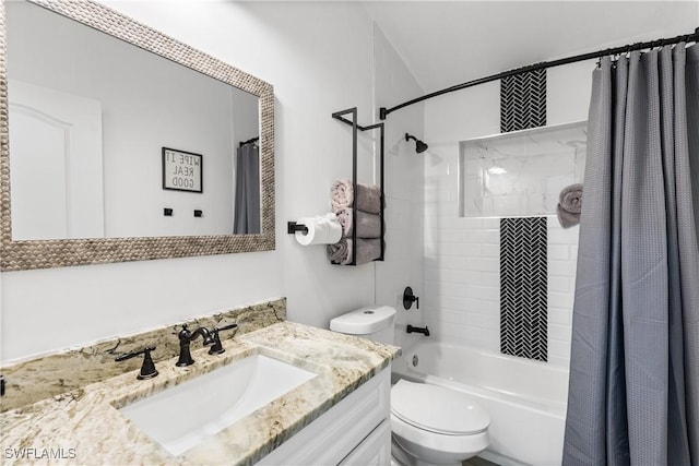 full bathroom featuring shower / tub combo, vanity, and toilet