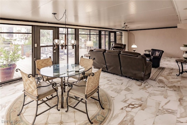 dining space featuring marble finish floor and ceiling fan