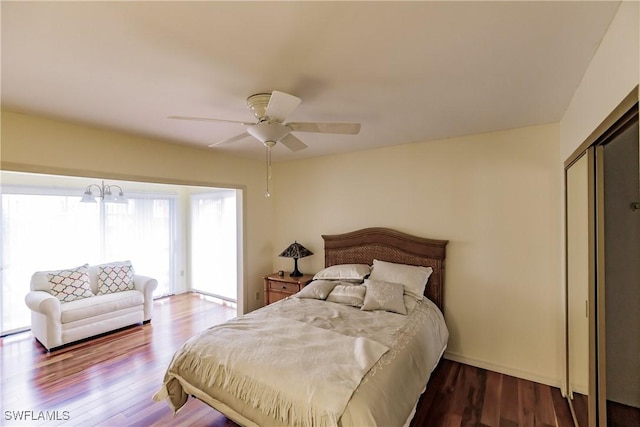 bedroom with a closet, wood finished floors, and a ceiling fan