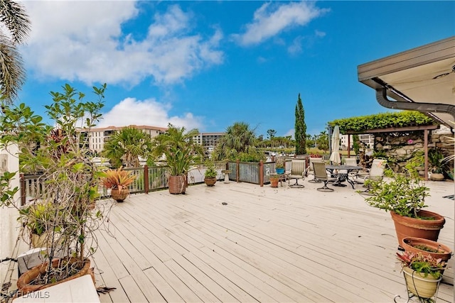 wooden deck featuring outdoor dining space