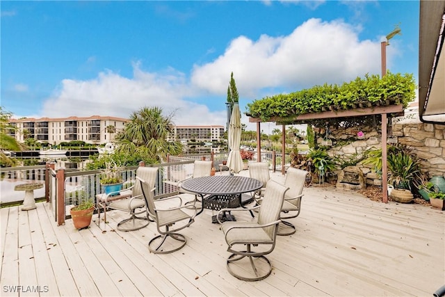 wooden deck featuring outdoor dining space