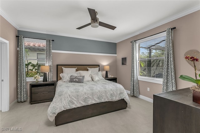 bedroom with baseboards, ornamental molding, and a ceiling fan