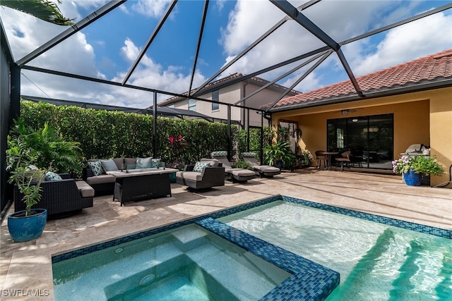 view of pool featuring a pool with connected hot tub, a patio, and an outdoor living space