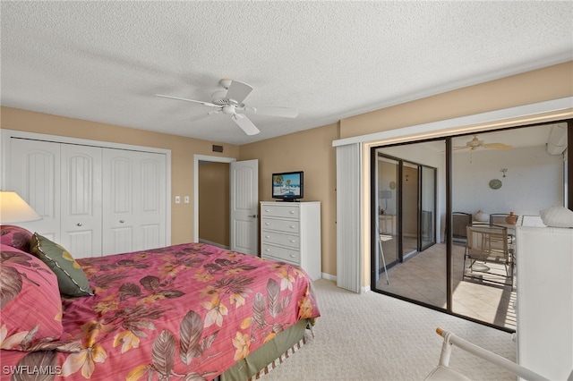 bedroom featuring a textured ceiling, visible vents, a ceiling fan, access to exterior, and carpet