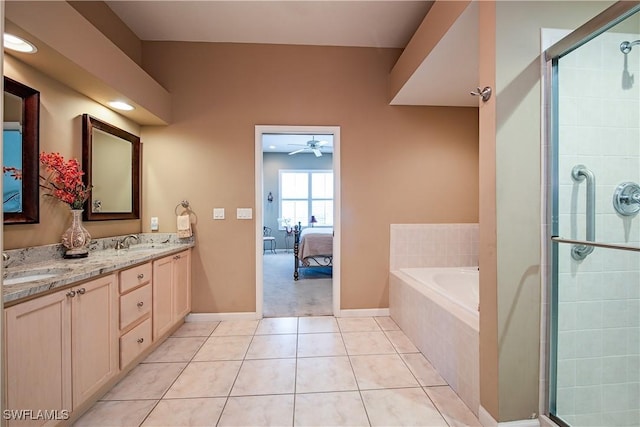 bathroom with a sink, tiled shower, a bath, tile patterned floors, and double vanity