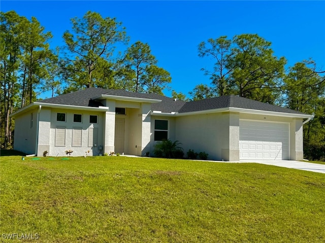 view of front of property with a garage, a front yard, and stucco siding