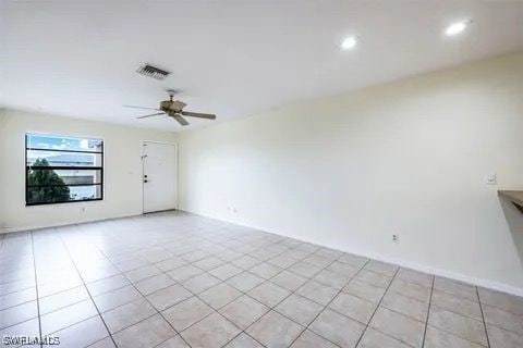 empty room with recessed lighting, ceiling fan, visible vents, and light tile patterned flooring