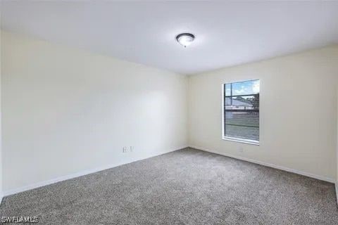 spare room with carpet floors