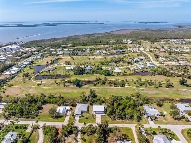 drone / aerial view with a water view and a residential view