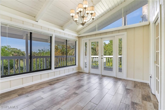 unfurnished sunroom with wood ceiling, french doors, lofted ceiling with beams, and an inviting chandelier