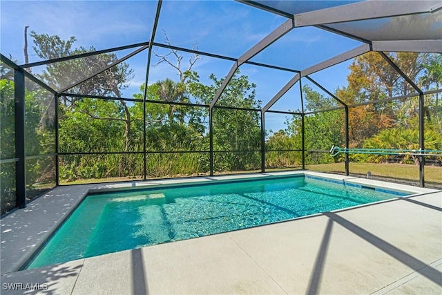 outdoor pool featuring a lanai and a patio