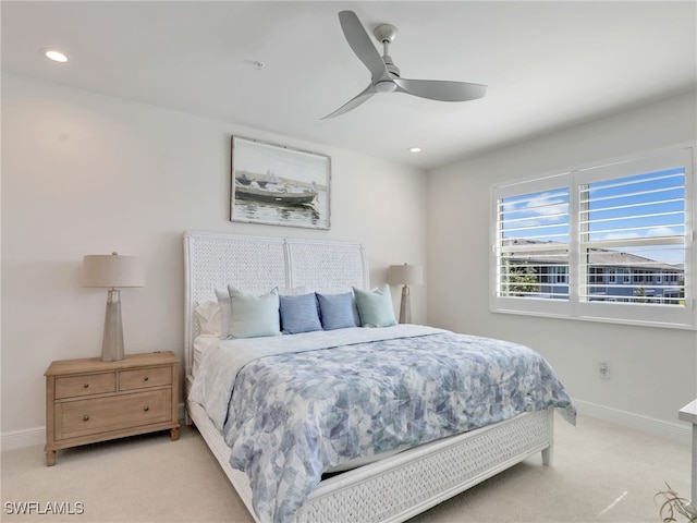 bedroom with recessed lighting, light carpet, ceiling fan, and baseboards