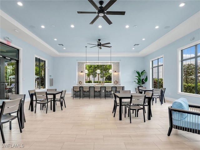 dining space featuring a tray ceiling, visible vents, baseboards, and recessed lighting