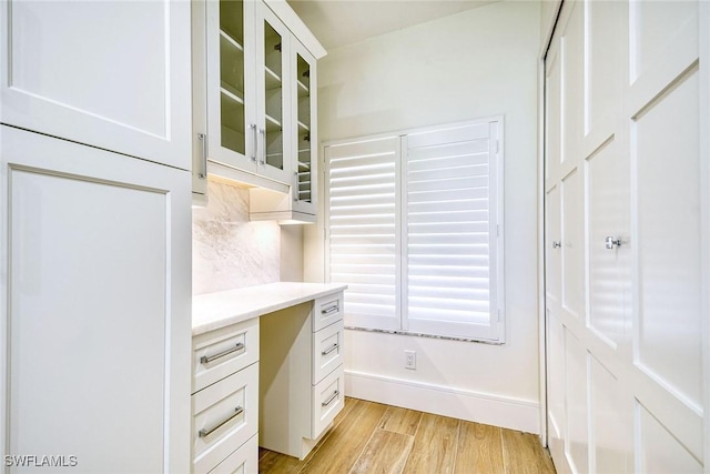 home office featuring light wood-style floors and baseboards