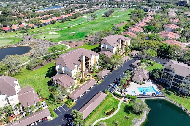 bird's eye view with a residential view, a water view, and golf course view