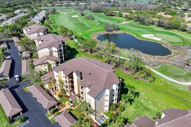 bird's eye view with a residential view, view of golf course, and a water view