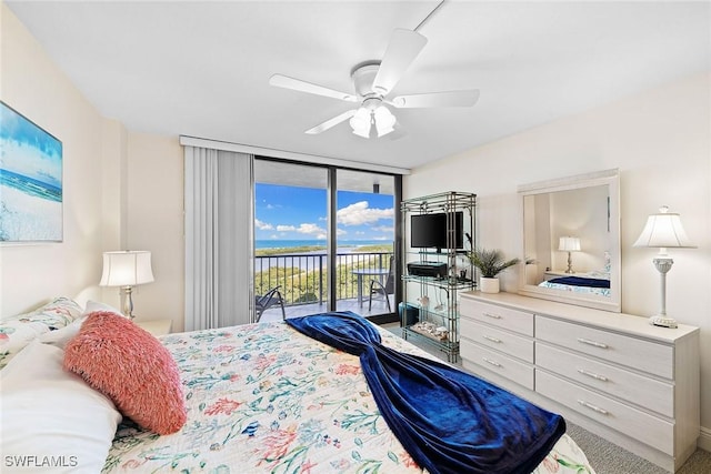 bedroom featuring access to exterior, floor to ceiling windows, and a ceiling fan