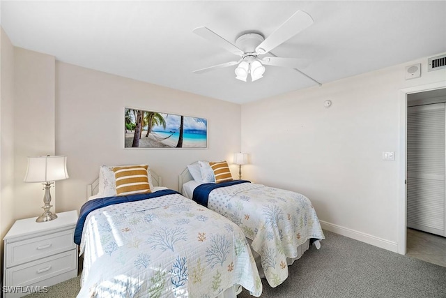 carpeted bedroom featuring a ceiling fan and baseboards