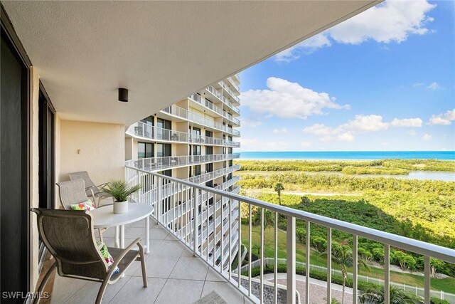 balcony featuring a water view