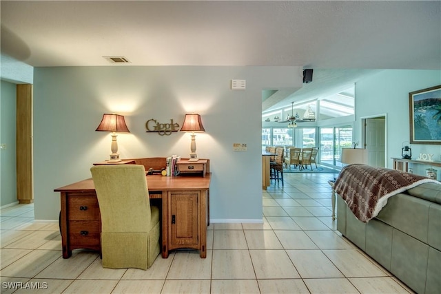 office space featuring lofted ceiling, light tile patterned floors, visible vents, and baseboards