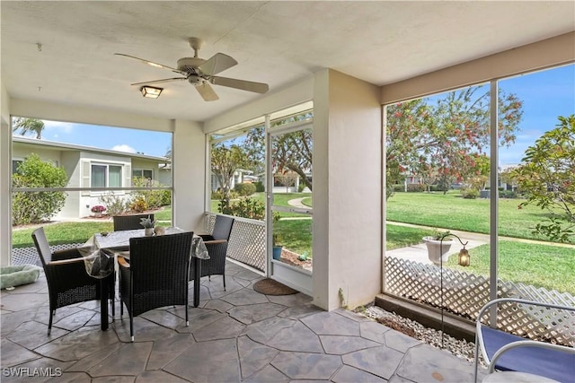 sunroom / solarium with ceiling fan