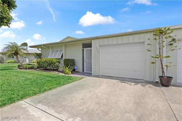 ranch-style house with concrete driveway, an attached garage, and a front lawn