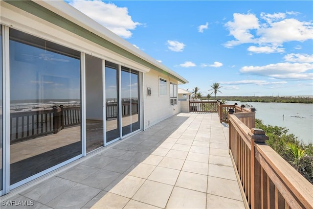 balcony featuring a water view