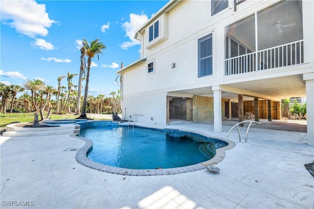 view of pool featuring a patio area and a pool with connected hot tub