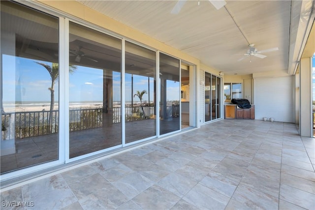 exterior space featuring ceiling fan