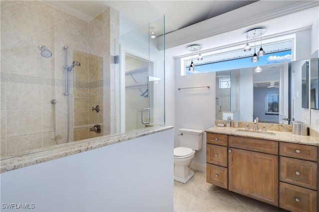 full bath with vanity, a tile shower, toilet, and tile patterned floors