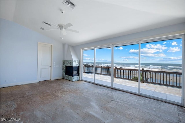 unfurnished living room with vaulted ceiling, ceiling fan, visible vents, and baseboards