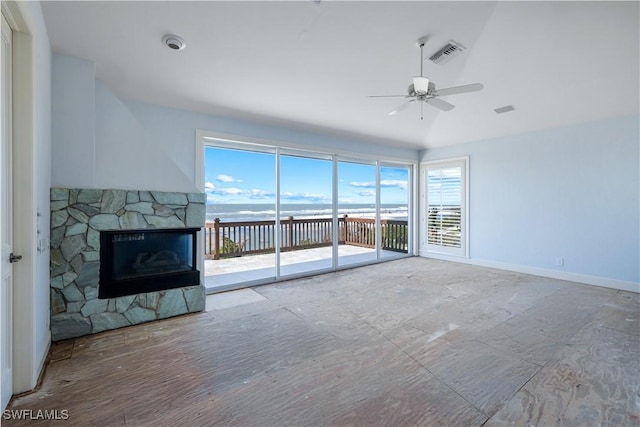 unfurnished living room with a healthy amount of sunlight, a fireplace, visible vents, and a ceiling fan