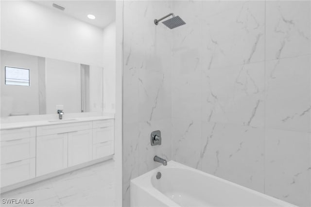 full bath featuring  shower combination, marble finish floor, visible vents, and vanity