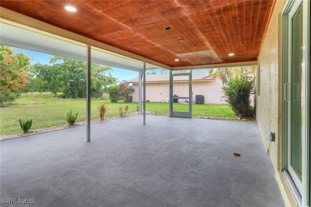 unfurnished sunroom with wood ceiling